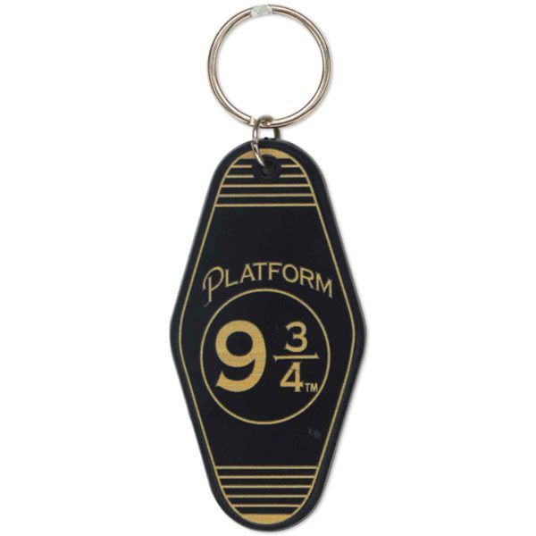 black diamond shape keychain tag with platform 9 3/4 written in gold ink for Harry Potter