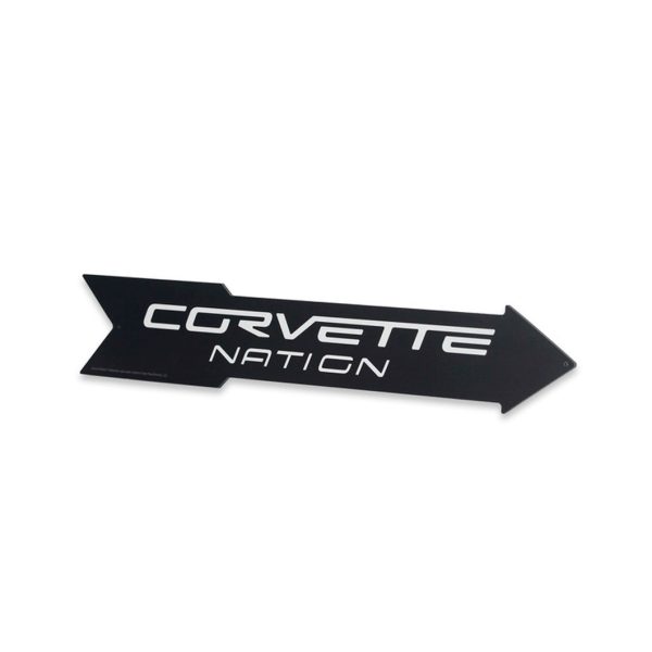 black metal arrow sign with corvette nation written in white